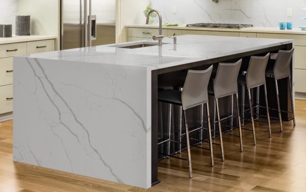 Kitchen with Island, Sink, Cabinets, and Hardwood Floors in New Luxury Home