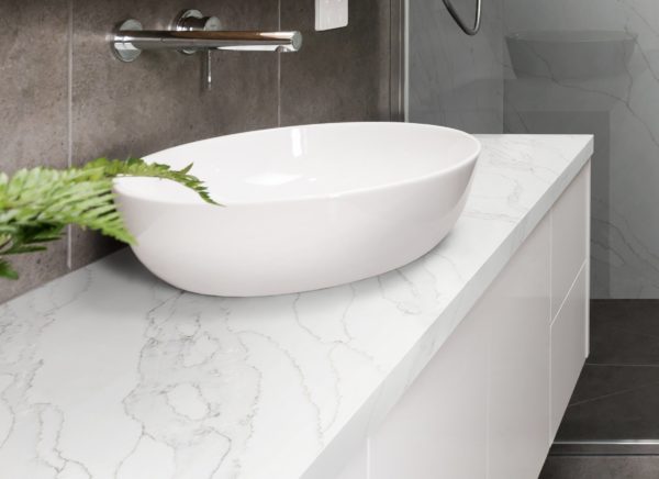 Marble mosaic herringbone tiled shower feature wall in a contemporary ensuite bathroom